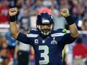 Seattle Seahawks quarterback Russell Wilson celebrates his touchdown pass to  wide receiver Chris Matthews (not pictured) in the final seconds of the first half against the New England Patriots during the NFL Super Bowl XLIX football game in Glendale, Arizona, February 1, 2015. (REUTERS/Lucy Nicholson)