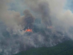 Smoke rises from a wildfire north of Cold Lake, Alberta May 27, 2015 in a photo supplied by the Alberta Wildfire Info department.