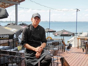 Wolfe Island Grill owner and head chef Casey Fisher on the patio of the restaurant. (Julia McKay/The Whig-Standard)