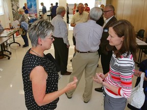 Luke Hendry/The Intelligencer
Sheila Barber, left, talks with Quinte Health Care senior communications director Susan Rowe during an open house at Belleville General Hospital in Belleville Thursday. The hospital corporation and the South East Local Health Integration Network organized the gathering to poll residents' views on hospitals and to brief them on the changing health care system.