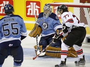 Quebec Remparts? Jerome Verrier tips the puck for a goal on Rimouski Oceanic goalie Philippe Desrosiers during the first period of the Memorial Cup tiebreaker at the Colisee Pepsi in Quebec City on Thursday. (Reuters)