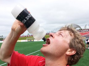 Coun. David “The Captain” Chernushenko takes a drink  of some water during a friendly match against the media at TD Place on Thursday. KEATON ROBBINS/OTTAWA SUN