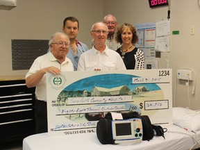Ron Lavoie, chair of the Seaforth Hospital Foundation; Bill Scott, a member of the trustee board; Anne Campbell, site administrator of the Seaforth hospital site; Dick Burgess, past-chair of the Huron Perth Healthcare Alliance Board and the current Seaforth-area board member; and Dr. Andrzej Kluz, a physician at the hospital, pose alongside the new defibrillator. (Marco Vigliotti/Huron Expositor)