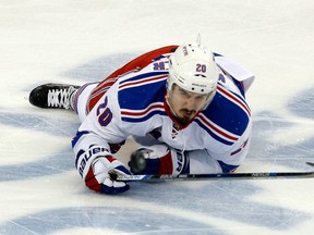 Chris Kreider of the New York Rangers lays on the ice after a play during the first period against the Tampa Bay Lightning in Game 4 of the Eastern Conference finals during the 2015 NHL playoffs at Amalie Arena on May 22, 2015. (Mike Carlson/Getty Images/AFP)