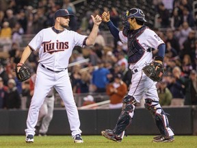 Minnesota Twins relief pitcher Glen Perkins (15) celebrates with catcher Kurt Suzuki after a 2-1 victory over the Boston Red Sox on May 26, 2015, at Target Field in Minneapolis. (JESSE JOHNSON/USA TODAY Sports)