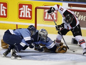 Quebec Remparts' Marc-Olivier Roy scores a goal against the Rimouski Oceanic during the third period of their Memorial Cup hockey game at the Colisee Pepsi on May 28, 2015. (REUTERS/Mathieu Belanger)