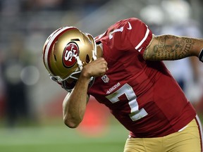 Colin Kaepernick of the San Francisco 49ers celebrates after a 90 yard touchdown in the third quarter against the San Diego Chargers at Levi's Stadium on December 20, 2014. (Thearon W. Henderson/Getty Images/AFP)