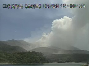 A video grab from the Japan Meteorological Agency's live camera image shows an eruption of Mount Shindake on Kuchinoerabujima island, Kagoshima Prefecture, southwestern Japan, May 29, 2015. The volcano erupted suddenly on Friday, blasting plumes of black smoke high into the sky, prompting authorities to order the evacuation of the island's residents and forcing airlines to divert some flights. REUTERS/Japan Meteorological Agency/Handout via Reuters