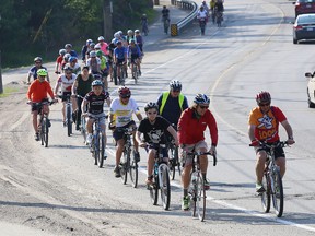 Olympian cross-country skier Devon Kershaw, front left, of Sudbury, leads a group of cyclist for Share the Road Ride in Sudbury, Ont. on Thursday May 28, 2015. John Lappa/Sudbury Star/Postmedia Network