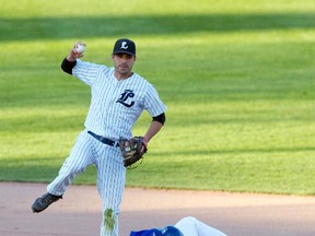 Guelph Royals' catcher Justin Interisano slides into second base after being tagged out as London Majors' second baseman Cody Mombourquette looks to throw the ball to first base during their Intercounty Baseball League game at Labatt Memorial Park in London, Ont. on Friday May 22, 2015. (Craig Glover/The London Free Press/Postmedia Network)