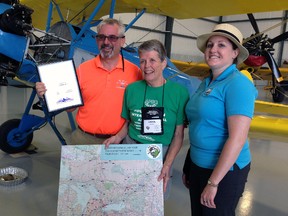 St. Thomas Municipal Airport superintendent Dale Arndt, left, and Mayor Heather Jackson, right, welcome Interprovincial Air Tour organizer Carol Cooke to the Railway City. St. Thomas is the first of four stops 40 private pilots and their passengers are making in the coming days.