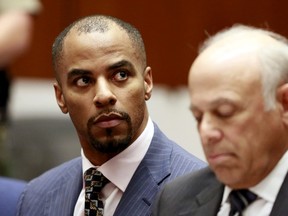 Former National Football League star Darren Sharper (L) and his attorney Leonard Levine appear in court in Los Angeles, in this file photo taken March 23, 2015.  Sharper, who last month pleaded guilty or no contest to rape or attempted rape charges in three states, was set to be arraigned on April 7, 2015 in a New Orleans courtroom on additional charges of drugging and raping two women.  To match USA-NFL/SHARPER REUTERS/Nick Ut/Pool/Files