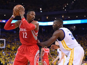 Houston Rockets center Dwight Howard (12) looks to score as Golden State Warriors center Festus Ezeli (31) defends during the first half in game five of the Western Conference Finals of the NBA Playoffs. at Oracle Arena. Kyle Terada-USA TODAY Sports
