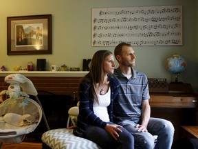 Emily and Matt Knudsen sit in their living room in their home in Fremont, Calif., on May 14, 2015. (REUTERS/Beck Diefenbach)