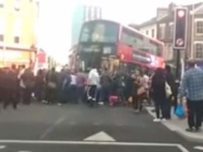 Bystanders in London swarmed a double-decker bus to lift it off a man who'd been run down during rush hour Thursday, May 28, 2015. (YouTube)