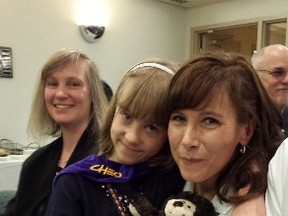 OTTAWA - May 29, 2015 - Sienna Knapp, a 10-year-old Kingston girl and CHEO patient, hugs her doctor, Dr. Kym Boycott Friday during a funding announcement for a $7.6-million program to research the causes of rare pediatric diseases. Dr. Boycott will lead the program at CHEO's research institute.
Corey Larocque, Ottawa Sun, Postmedia Network