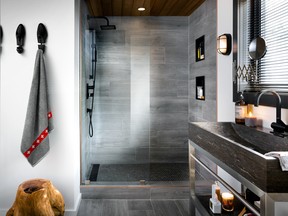 Grey-coloured tile in slab form for the walls of the shower, and a mini-hexagonal mosaic for the floor, help to create a slick, fresh look.