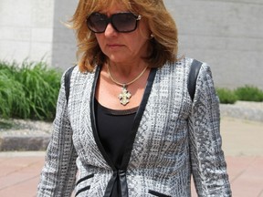 Pembroke dentist Dr. Christy Natsis leaves the Elgin Street courthouse in Ottawa Friday, May 29, 2015 after she was convicted of impaired and dangerous driving causing death, in the March 2011 crash that killed Bryan Casey. 
(TONY SPEARS/Ottawa Sun/Postmedia Network)