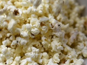 A former movie theatre manager lured young boys with popcorn, free movies, and video game tokens before exploiting them for sex, a court heard Friday.