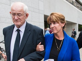 Bryan Casey's widow LeeEllen Carroll leaves the Ottawa Courthouse with her father-in-law Gus Casey after Pembroke dentist Christy Natsis was found guilty of impaired driving causing death on Friday May 29, 2015. 
Errol McGihon/Ottawa Sun/Postmedia Network