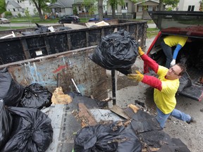 Marco participates in the community clean up along Selkirk Avenue in Winnipeg.