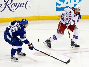 Ryan McDonagh of the New York Rangers takes a shot against Nikita Kucherov of the Tampa Bay Lightning in Game 6 of the Eastern Conference Finals during the 2015 NHL playoffs at Amalie Arena on May 26, 2015. (Brian Blanco/Getty Images/AFP)