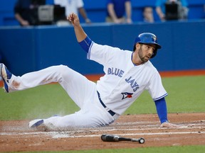 Chris Colabello went 8-for-14 with five RBI against the Blue Jays during his time with the Twins last April. (STAN BEHAL/TORONTO SUN)