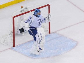 Tampa Bay Lightning goalie Ben Bishop celebrates after defeating the New York Rangers in Game 7 of the Eastern Conference final of the 2015 NHL playoffs at Madison Square Garden on May 29, 2015. (Adam Hunger/USA TODAY Sports)