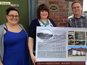 Municipal Heritage Committee members Allison Sinclair, left, and Russell Schnurr, right, and Elgin County Railway Museum manager Dawn Miskelly unveil the plaque commemorating the museum building's official heritage designation. The museum occupies the former Michigan Central Railroad locomotive repair shop built in 1913.