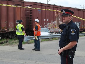 A man was injured after a car travelling south on St. George St. collided with a westbound CP freight train at Piccadilly St. on May 30. DALE CARRUTHERS / THE LONDON FREE PRESS