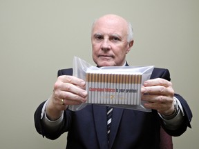 Gary Grant, spokesman for the National Coalition Against Contraband Tobacco, displays a package of contraband cigarettes.
MICHAEL-ALLAN MARION / Postmedia Network