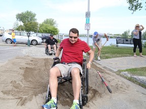 Kevin Heath navigate a sand and gravel course simulating the difficulties people using mobility devices may face on their daily commute. Jason Miller / The Intelligencer