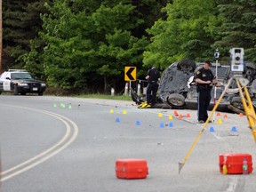 A motorcyclist was killed after a three vehicle motor-vehicle collision on Perth Road north of Buck Lake in South Frontenac north of Kingston, Ont. on Saturday May 30, 2015. Steph Crosier/Kingston Whig-Standard/Postmedia Network