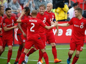 Toronto FC celebrates after going up 2-1 on San Jose Earthquake during the first half in MLS action at BMO Field on Saturday night. (JACK BOLAND/TORONTO SUN)