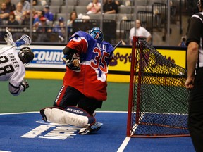 Zack Greer of the Edmonton Rush scores on Rock goaltender Nick Rose during Game 1 of the Champion's Cup final on Saturday night at the Air Canada Centre. (JACK BOLAND/TORONTO SUN)