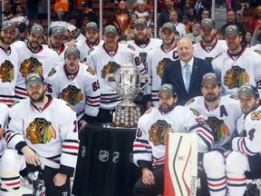 Members of the Chicago Blackhawks pose with the Clarence S. Campbell Bowl after game seven of the Western Conference Final of the 2015 Stanley Cup Playoffs against the Anaheim Ducks at Honda Center May 30, 2015. (Jerry Lai-USA TODAY Sports)