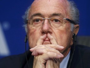 Re-elected FIFA President Sepp Blatter pauses during a news conference after an extraordinary Executive Committee meeting in Zurich, Switzerland, May 30, 2015.  REUTERS/Arnd Wiegmann