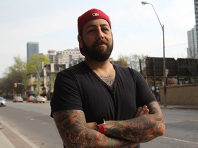 Jonny Silverstein, owner of The Village Ink tattoo salon, has 76 tattoos - one of which he would like to cover up. (Angela Hennessy/Special to the Toronto Sun)