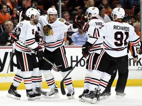 Marian Hossa #81 of the Chicago Blackhawks celebrates his second period goal with teammates against the Anaheim Ducks in Game Seven of the Western Conference Finals during the 2015 NHL Stanley Cup Playoffs at the Honda Center on May 30, 2015 in Anaheim, California.   (Harry How/Getty Images/AFP)