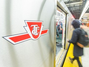 People board a TTC train on the subway platform at Bloor-Yonge station in Toronto. (Ernest Doroszuk/Toronto Sun)