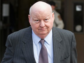 Suspended Senator, Mike Duffy exits the Ottawa courthouse after his trial on Wednesday.  Joel Watson/Ottawa Sun/PostMedia Network