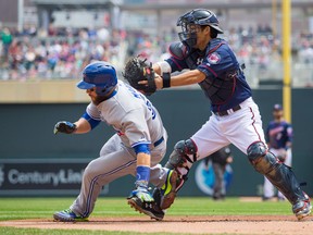 Minnesota Twins catcher Kurt Suzuki (8) tags out Toronto Blue Jays catcher Russell Martin (55) in the second inning at Target Field in Minneapolis May 31, 2015. (Brad Rempel-USA TODAY Sports)