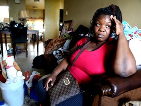 Abigail Gordon, a single mom in her TCHC apartment after two sewage floods on Wednesday May 27, 2015. (Veronica Henri/Toronto Sun)