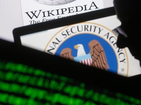 NSA symbol can be seen behind another computer monitor. 

REUTERS/Dado Ruvic