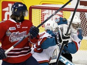 Kelowna Rockets goalie Jackson Whistle makes an awkward-looking save against the Oshawa Generals during the first period of the Memorial Cup final at the Colisee Pepsi in Quebec City on Sunday night. (Reuters)