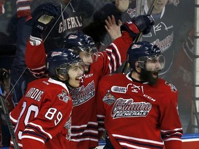 Oshawa Generals' Anthony Cirelli celebrates his goal with teammates Sam Harding (89) and Hunter Smith (R) during the second period of their Memorial Cup final hockey game against the Kelowna Rockets at the Colisee Pepsi in Quebec City, May 31, 2015. (REUTERS/Mathieu Belanger)