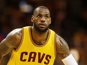 LeBron James #23 of the Cleveland Cavaliers reacts in the first quarter against the Atlanta Hawks during Game Three of the Eastern Conference Finals of the 2015 NBA Playoffs at Quicken Loans Arena on May 24, 2015 in Cleveland, Ohio. (Gregory Shamus/Getty Images/AFP)