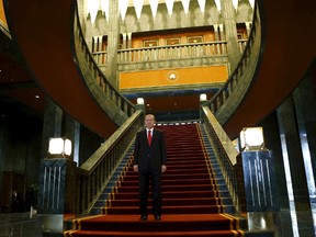 Turkey's President Tayyip Erdogan poses after an official ceremony to mark Republic Day at the new Presidential Palace in Ankara, Turkey, in this October 29, 2014 file photo. Erdogan says he will resign if opposition leader Kemal Kilicdaroglu can find a golden toilet seat in his new palace. REUTERS/Umit Bektas/Files