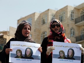 Women hold posters of French national Isabelle Prime, right, and her Yemeni translator Shereen Makawi during a rally to show solidarity with them in Sanaa March 5, 2015. The two women were snatched from their taxi by gunmen near a ministry building at 45th Street in the south of the capital on February 24. The posters read, "Freedom for Isabelle Prime and Shereen Makawi".  REUTERS/Khaled Abdullah