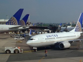 A United Airlines airplane is towed to a gate after arriving at Newark Liberty International Airport in Newark, N.J., in this June 18, 2011 file photo. (REUTERS/Gary Hershorn)